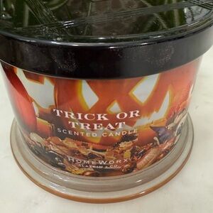 Trick or Treat Scented Candle: Chocolate Bars, Vanilla, Coconut, Cooked Sugar.